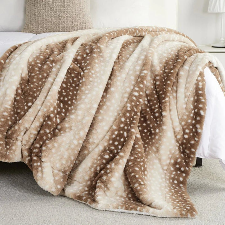 Warm & cozy reversible faux fur deer blanket. Plush throw offers ultimate comfort for bedroom or living room.