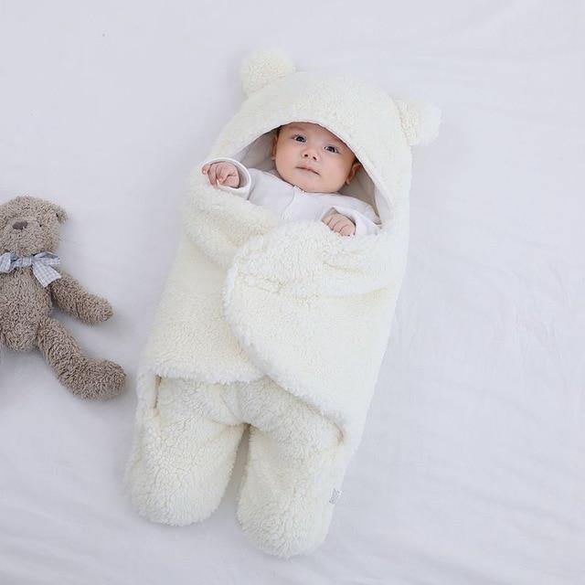Unisex hooded baby swaddle blanket with bear ears, a must-have for infant soothing.