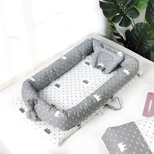 Unisex foldable baby travel crib with mesh sides, portable sleeper for infant comfort & safe sleep, cotton fabric.