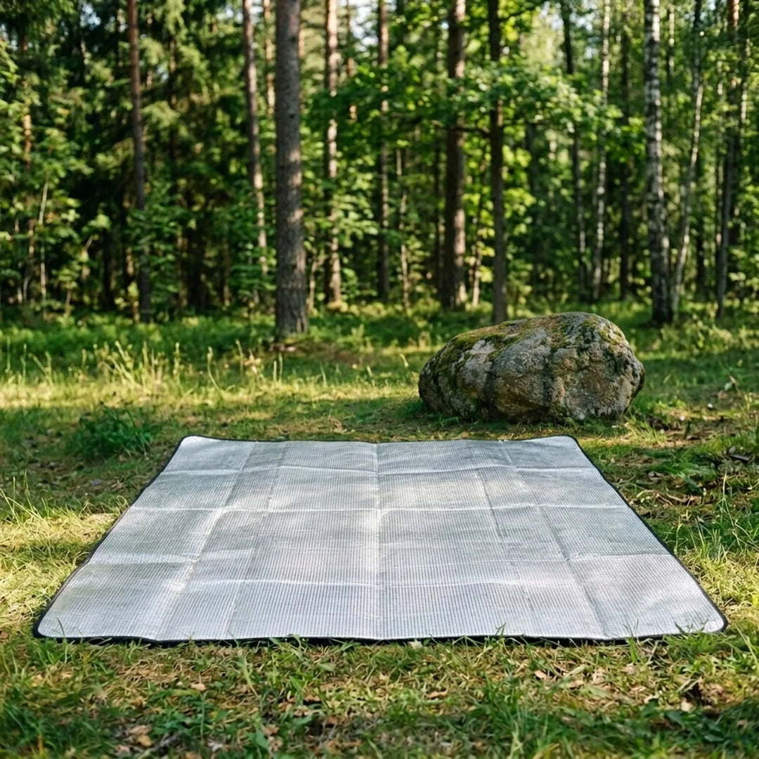 Unisex foldable reflective camping mat provides insulation for outdoor sleeping, hiking, and picnics.