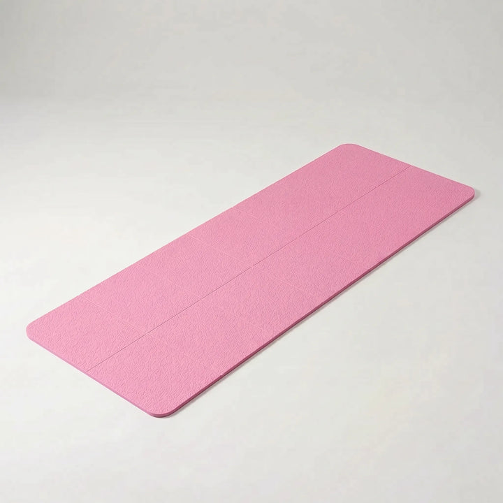 Foldable TPE yoga mat, unisex design, lightweight and non-slip for travel, fitness & general exercise.