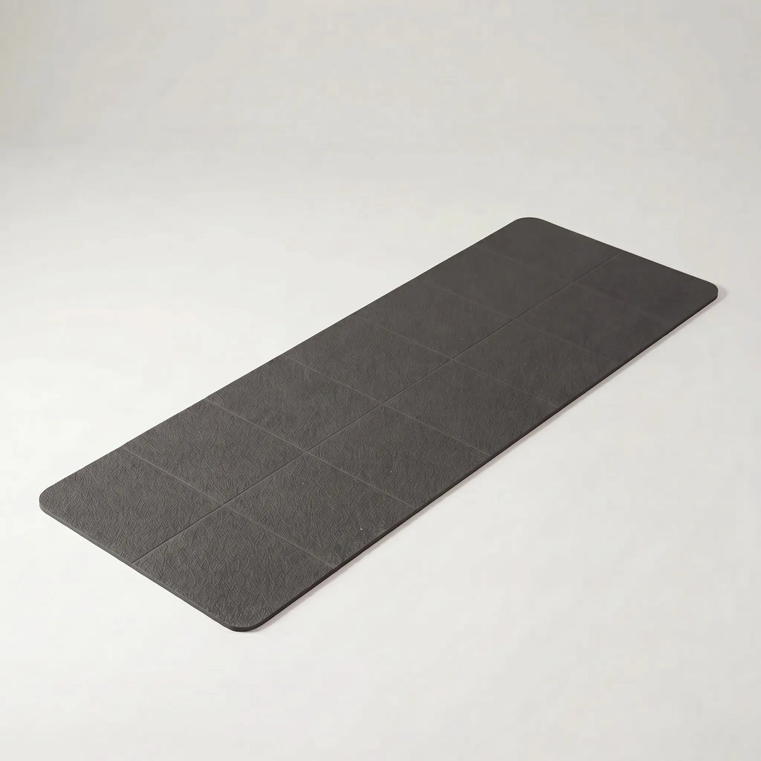 Essential foldable travel yoga mat, lightweight & non-slip TPE. Perfect portable fitness gear for any workout.
