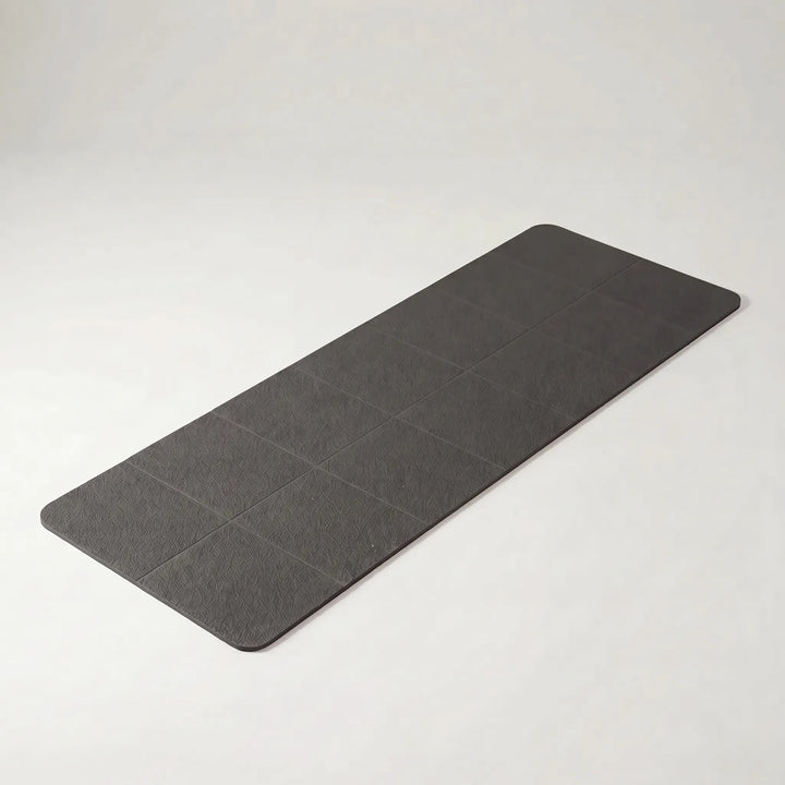 Essential foldable travel yoga mat, lightweight & non-slip TPE. Perfect portable fitness gear for any workout.