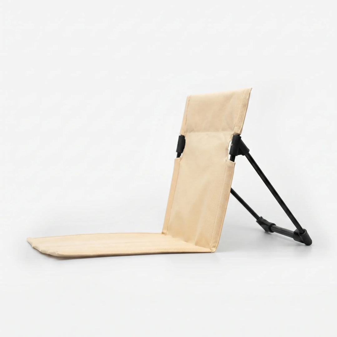 Versatile unisex folding floor chair for camping, picnics, concerts. Portable ground seating with strong back support.