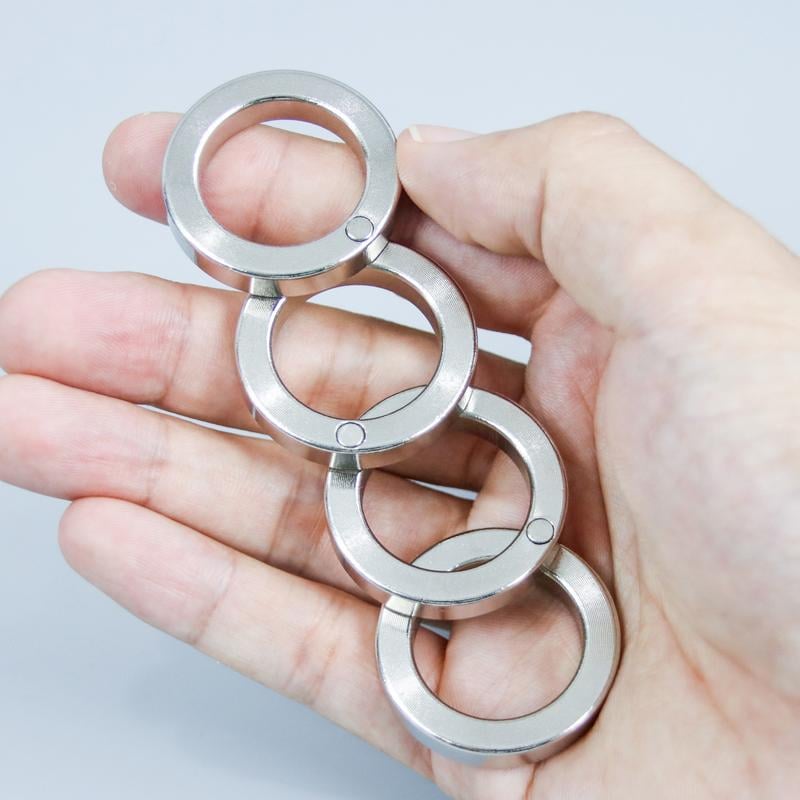 Compact folding four-finger fidget ring, ideal for stress & anxiety relief, fits pockets for portable calm.
