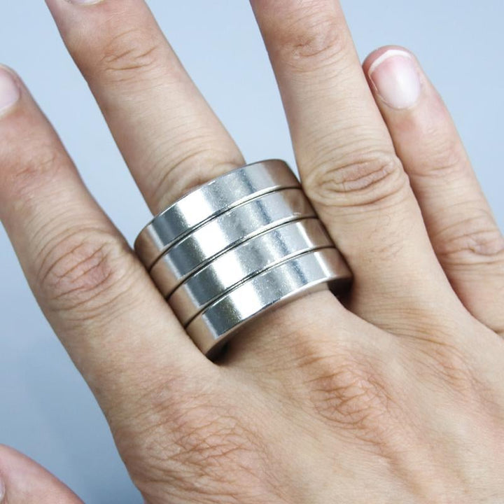 Modern unisex folding fidget ring, a desk toy & gadget for anxiety relief, enhancing focus & calm.