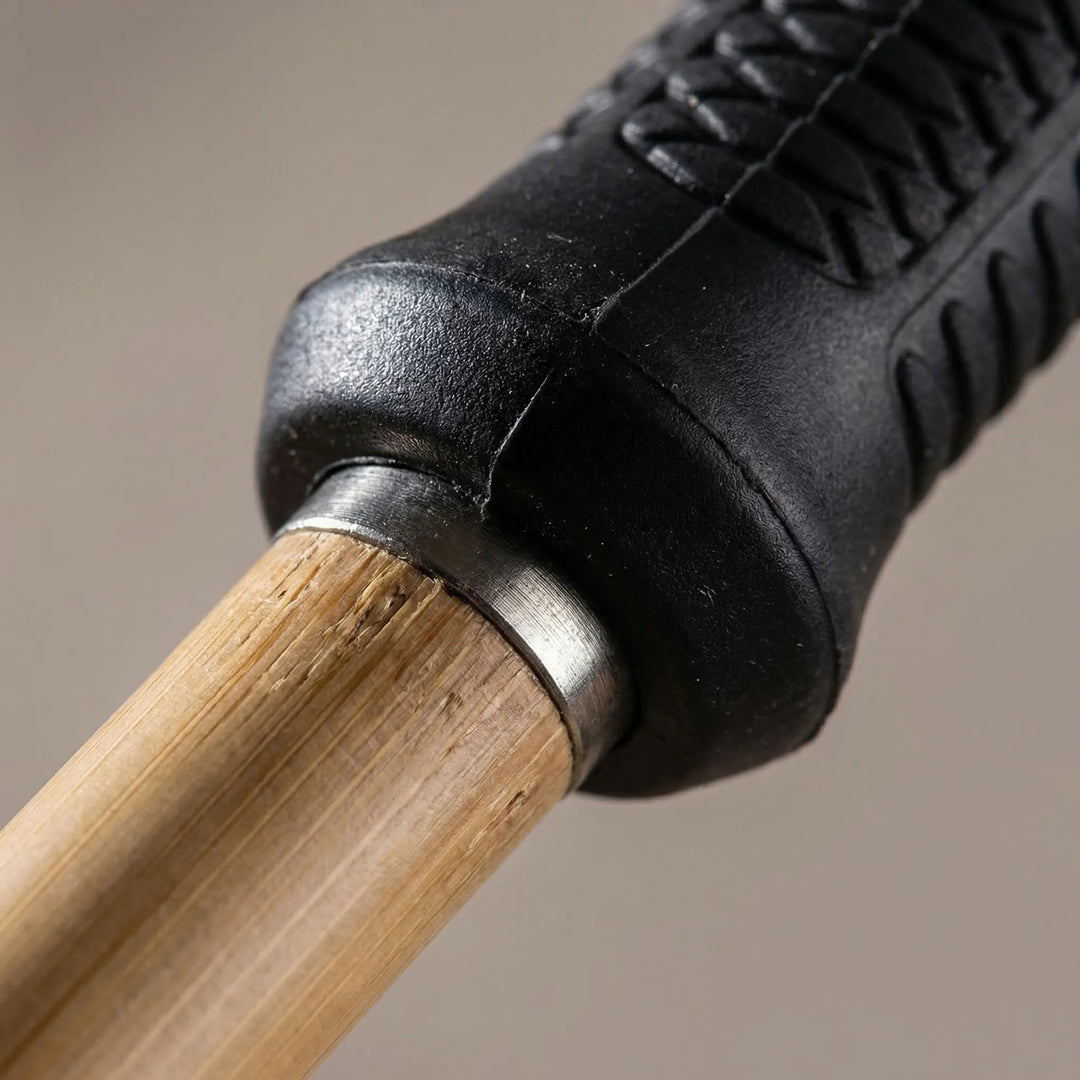 Lightweight folding walking stick with a stylish bamboo finish, offering durable support for trail walking.