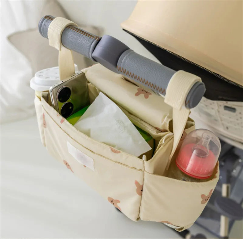 Stylish lion-themed stroller organizer, essential storage for baby's travel needs
