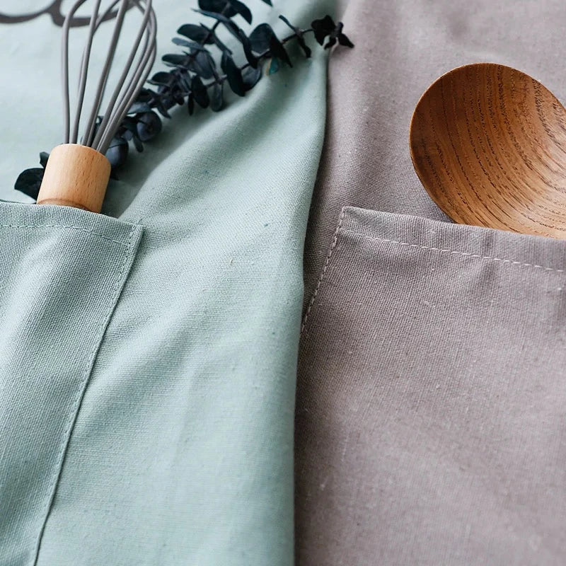 Child proudly wearing a fun bear apron, ready for their first cooking adventure.