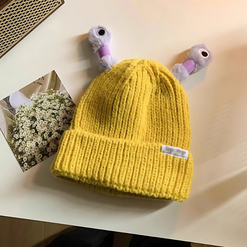 Overhead shot of Unisex Glowing Monster Knit Hat, showcasing novelty design and soft fabric