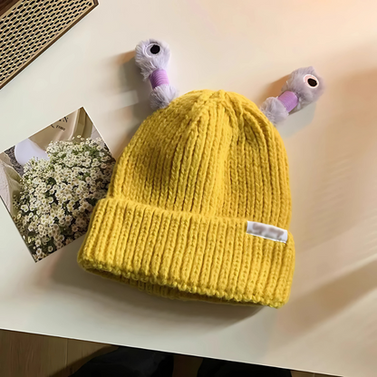 Overhead shot of Unisex Glowing Monster Knit Hat, showcasing novelty design and soft fabric