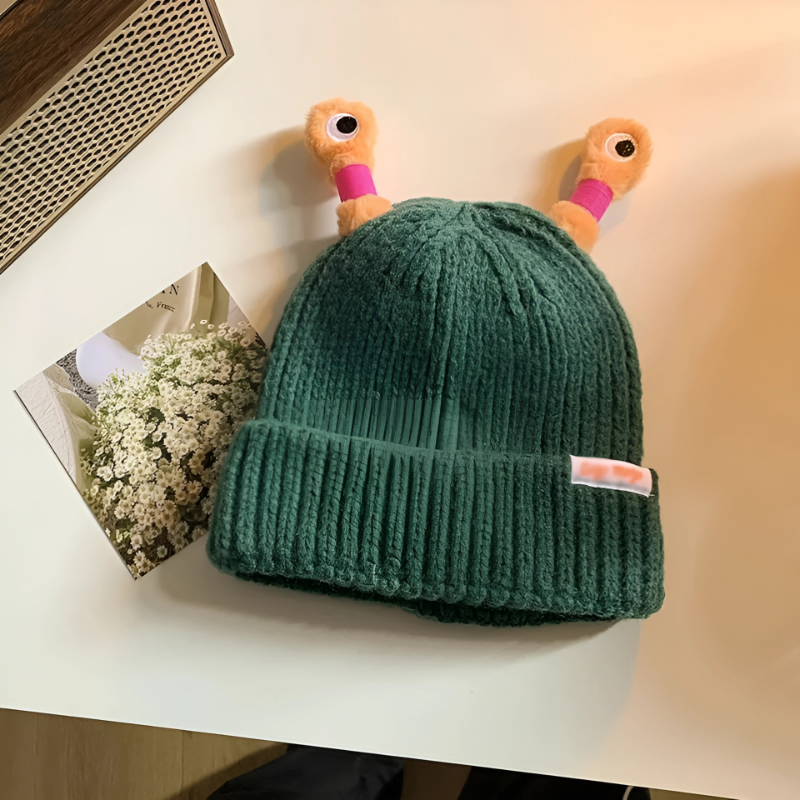 Stack of folded Fun Monster Glowing Knit Hats, ready for gifting, cozy and fun winter gift