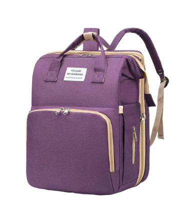 Diaper backpack in a nursery, filled with baby formula, toys, and outfits for daily use