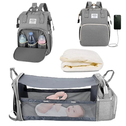 Newborn essentials in a unisex diaper backpack, highlighting its innovative foldable baby bed design