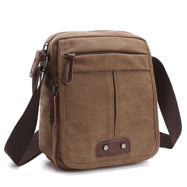 Durable brown canvas messenger bag, multiple zippered pockets, ideal for travel & daily utility.