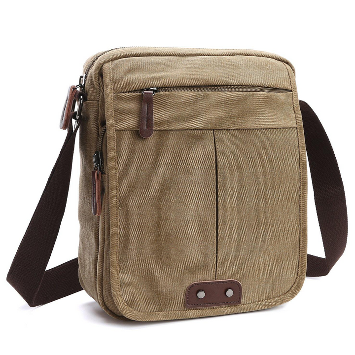 Khaki canvas travel crossbody bag with multiple compartments for organized essentials, adjustable strap.
