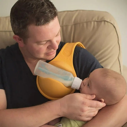 Ergonomic rubber baby bottle holder, providing a secure hands-free solution for nursing and feeding newborns.