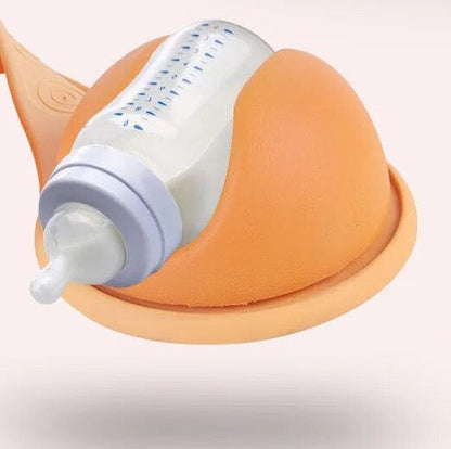 Close-up of a versatile baby bottle holder, showcasing its soft rubber material and hands-free feeding design.