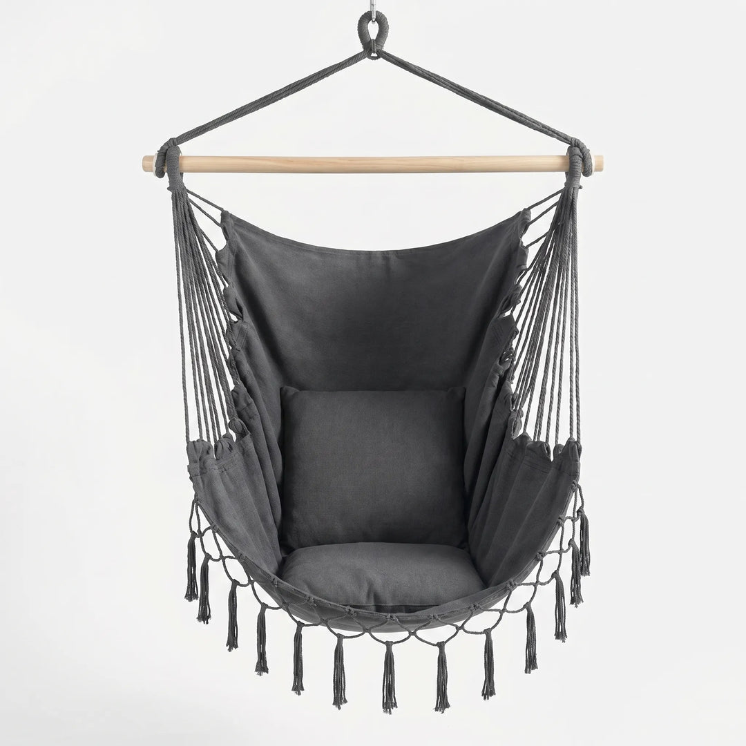 Stylish bohemian canvas swing chair, perfect as a cozy nook hanging seat for indoor or outdoor decor.