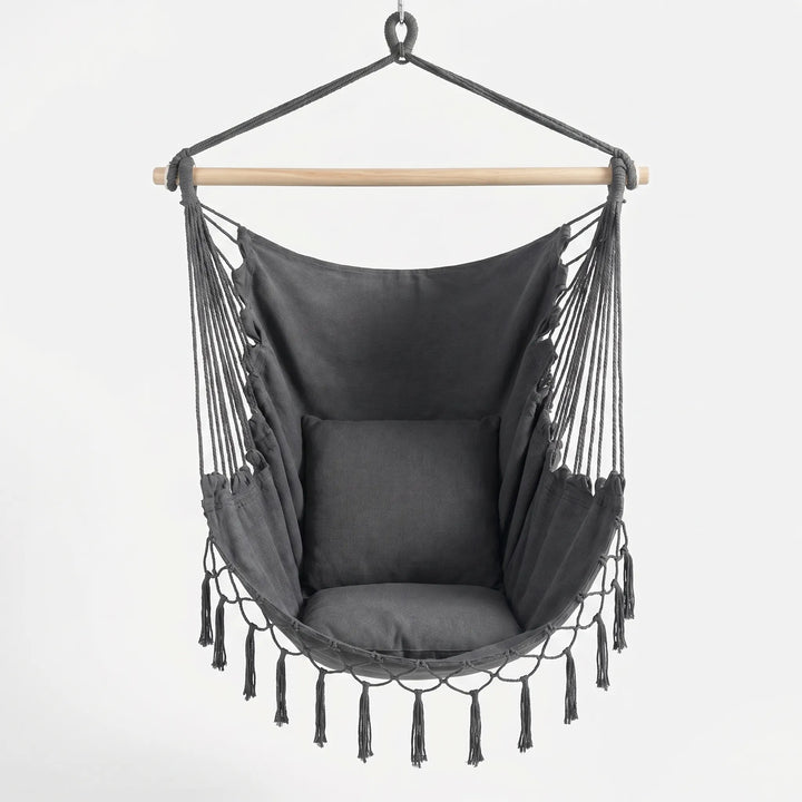 Stylish bohemian canvas swing chair, perfect as a cozy nook hanging seat for indoor or outdoor decor.