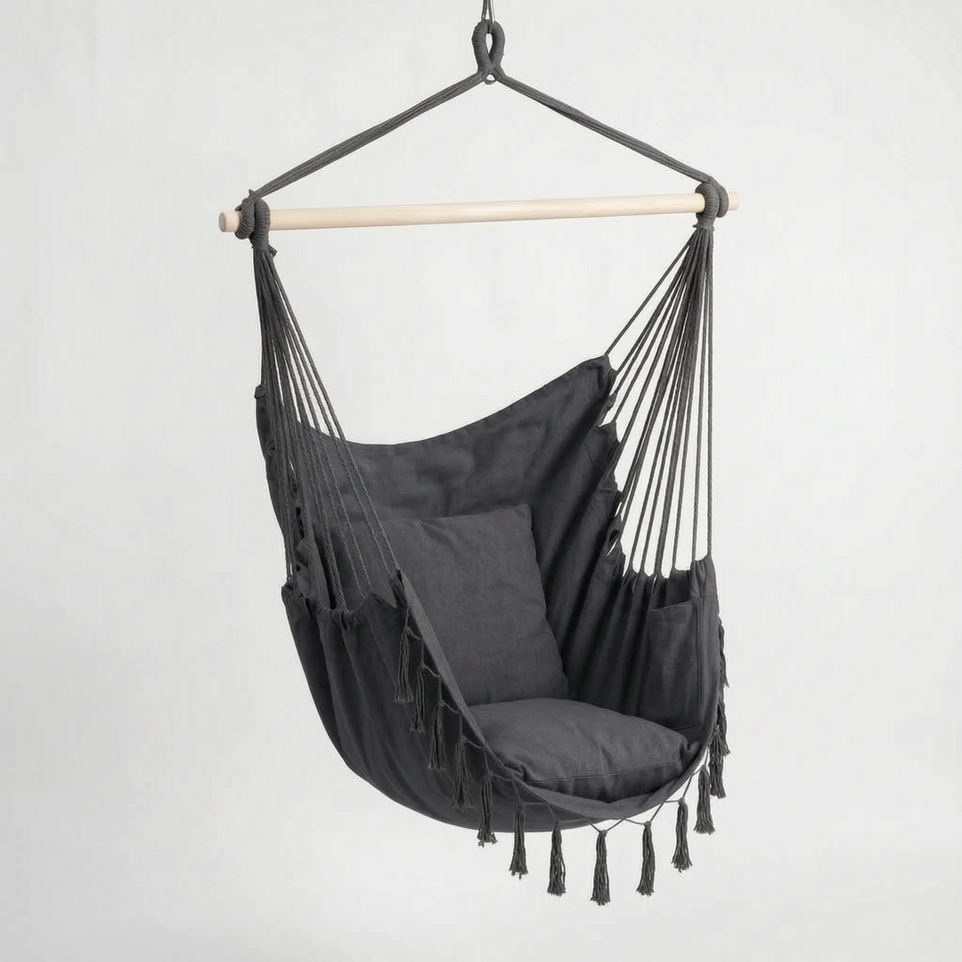 Unisex hanging swing chair for relaxation. A stylish bohemian canvas hammock seat for indoor/outdoor use.