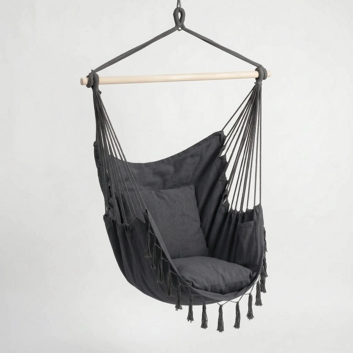 Unisex hanging swing chair for relaxation. A stylish bohemian canvas hammock seat for indoor/outdoor use.
