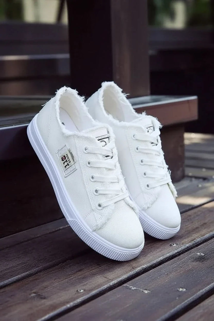 Stylish unisex high-top sneakers with durable canvas upper and classic lace-up design for ultimate comfort.