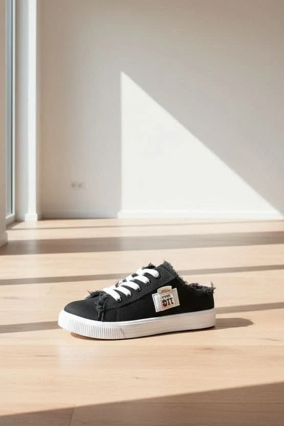 Person wearing trendy unisex high-top lace-up sneakers, pairing them with casual outfit for a streetwear look.