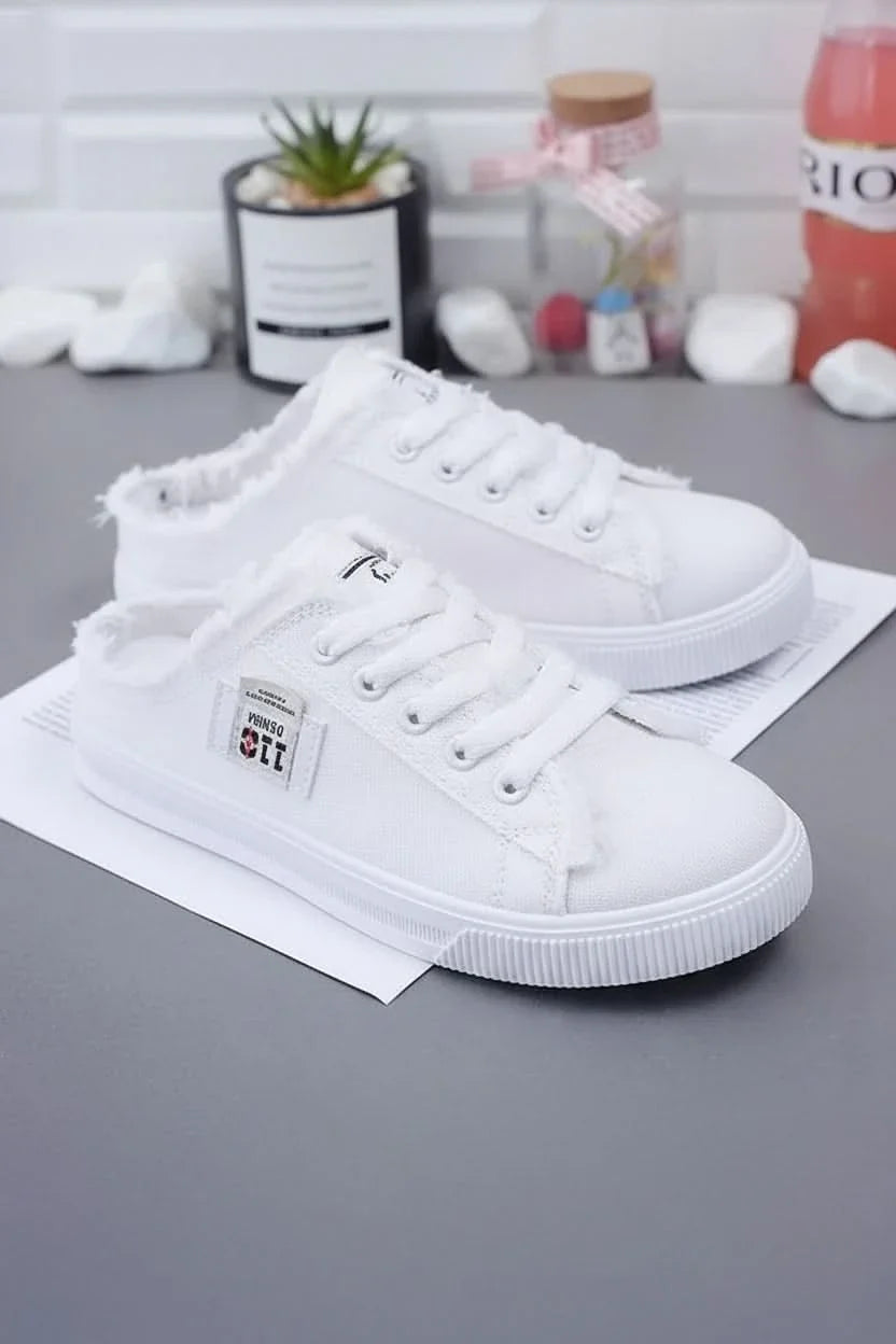 Back view of sleek unisex high-top sneakers, featuring a clean design ideal for everyday casual footwear.
