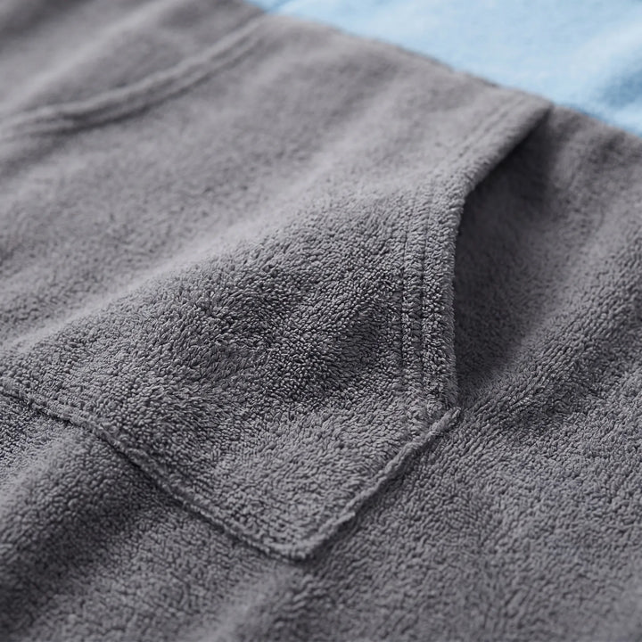 Versatile unisex changing robe, a beach essential for surf, swim, or any water sports; acts as a poncho towel.