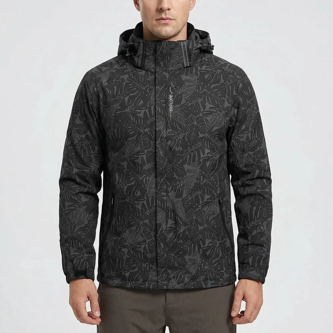 Person wearing a unisex botanical print full-zip hooded windbreaker jacket, enjoying a hike outdoors. Weather-resistant.