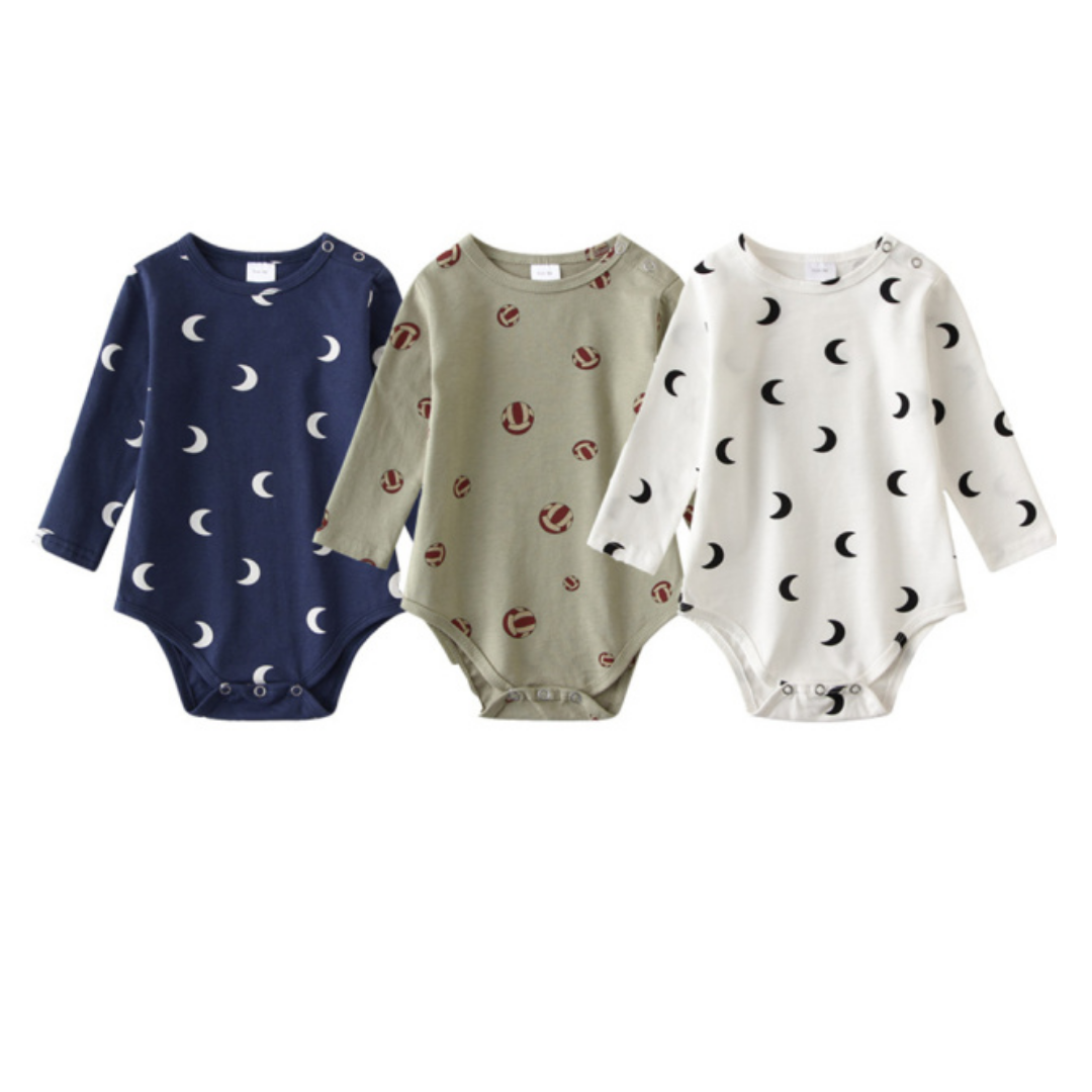 Close-up of a long sleeve unisex infant onesie from a 3-pack, showcasing a playful pattern print on cotton
