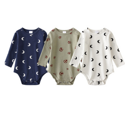 Close-up of a long sleeve unisex infant onesie from a 3-pack, showcasing a playful pattern print on cotton