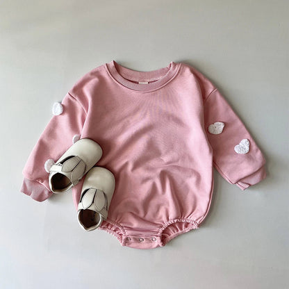 Organic cotton cloud print romper for infants, focusing on natural and soft baby clothes.