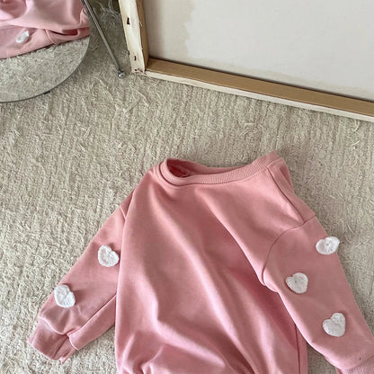 Playful cotton cloud print jumpsuit, ideal infant clothing for everyday adventures.