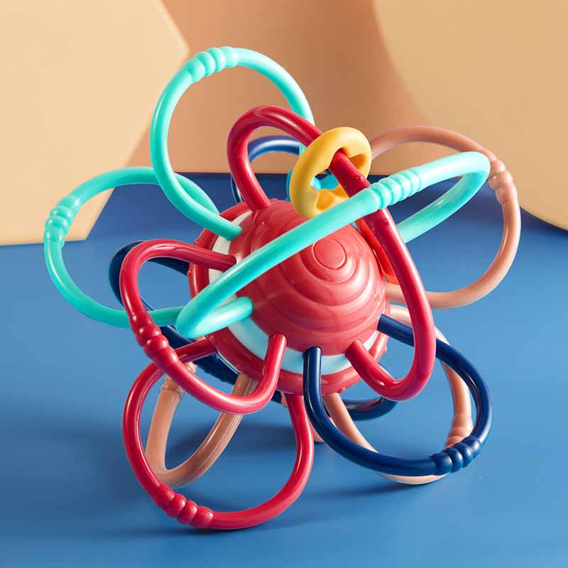 Close-up of vibrant sensory teether ball, multiple textures, promoting infant grasping skills