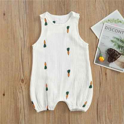 Newborn baby in a comfortable unisex sleeveless buttoned romper outfit.
