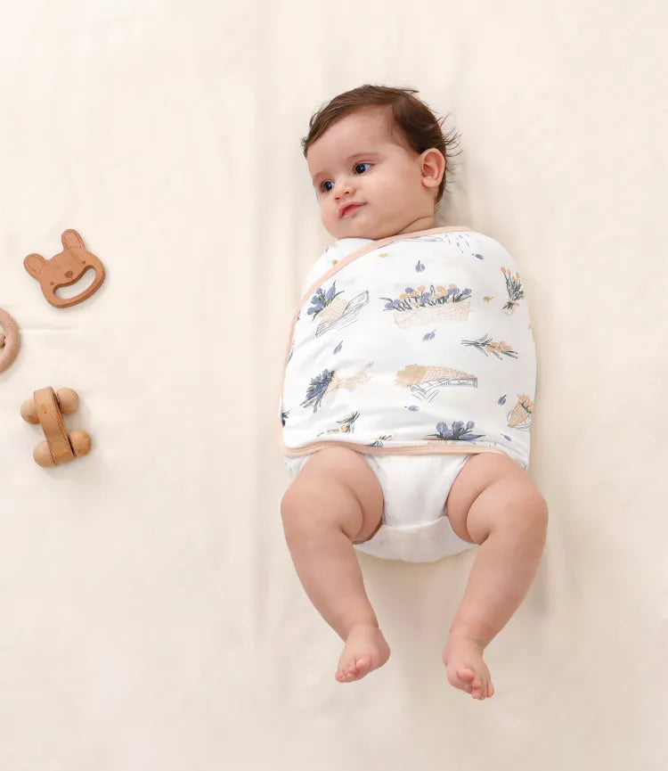 Unisex baby swaddle in a calming lavender hue, providing belly protection and peaceful baby sleep