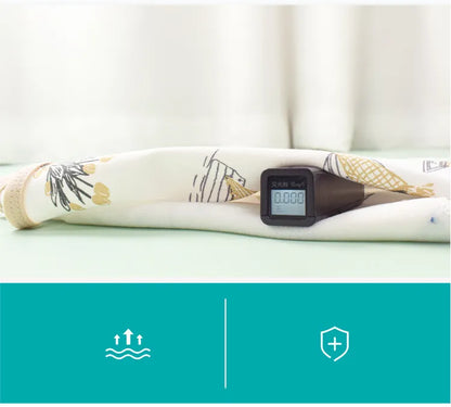 Newborn peacefully sleeping in a blue cotton swaddle, highlighting effective belly protection