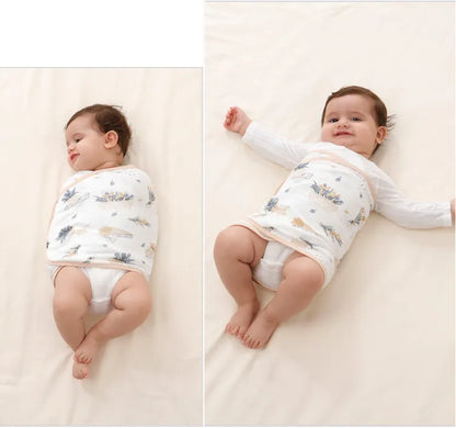 Close-up of a baby's hands peeking from a soft cotton swaddle, emphasizing belly protection & comfort