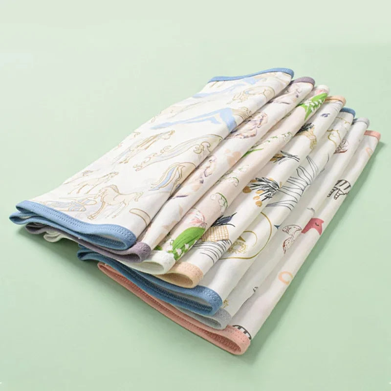 Closed-up view of a snugly wrapped baby in a white cotton swaddle, featuring belly protection