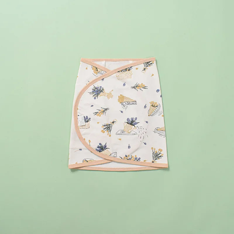 Soft green cotton swaddle blanket, offering comfort and crucial belly protection for newborns