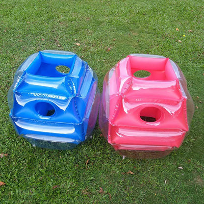 Children playing with inflatable bumper balls, active and fun outdoor garden toy