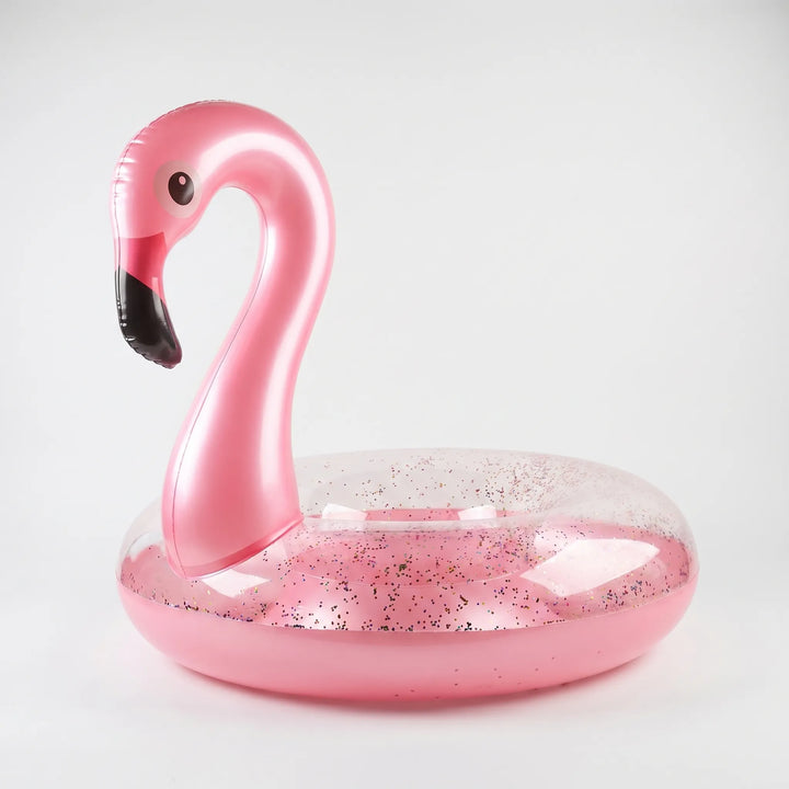 Sparkling pink inflatable flamingo water float, a fun summer pool toy & beach accessory for all ages.