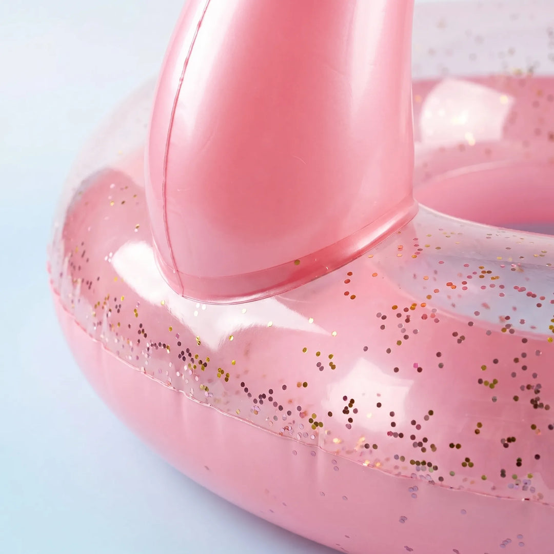 Large inflatable flamingo swim ring, essential water float for summer pool parties & beach vacation fun.