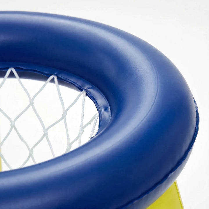 Family enjoying a summer pool party with an inflatable floating game set, perfect for water games.