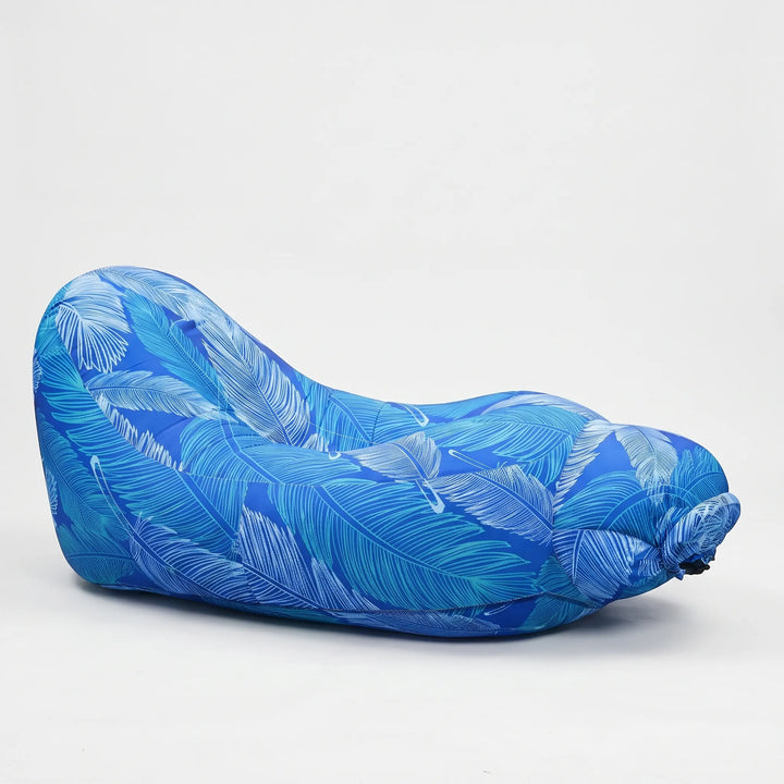 Portable inflatable lounge chair for beach gear or camping accessory. Comfortable unisex outdoor seating.