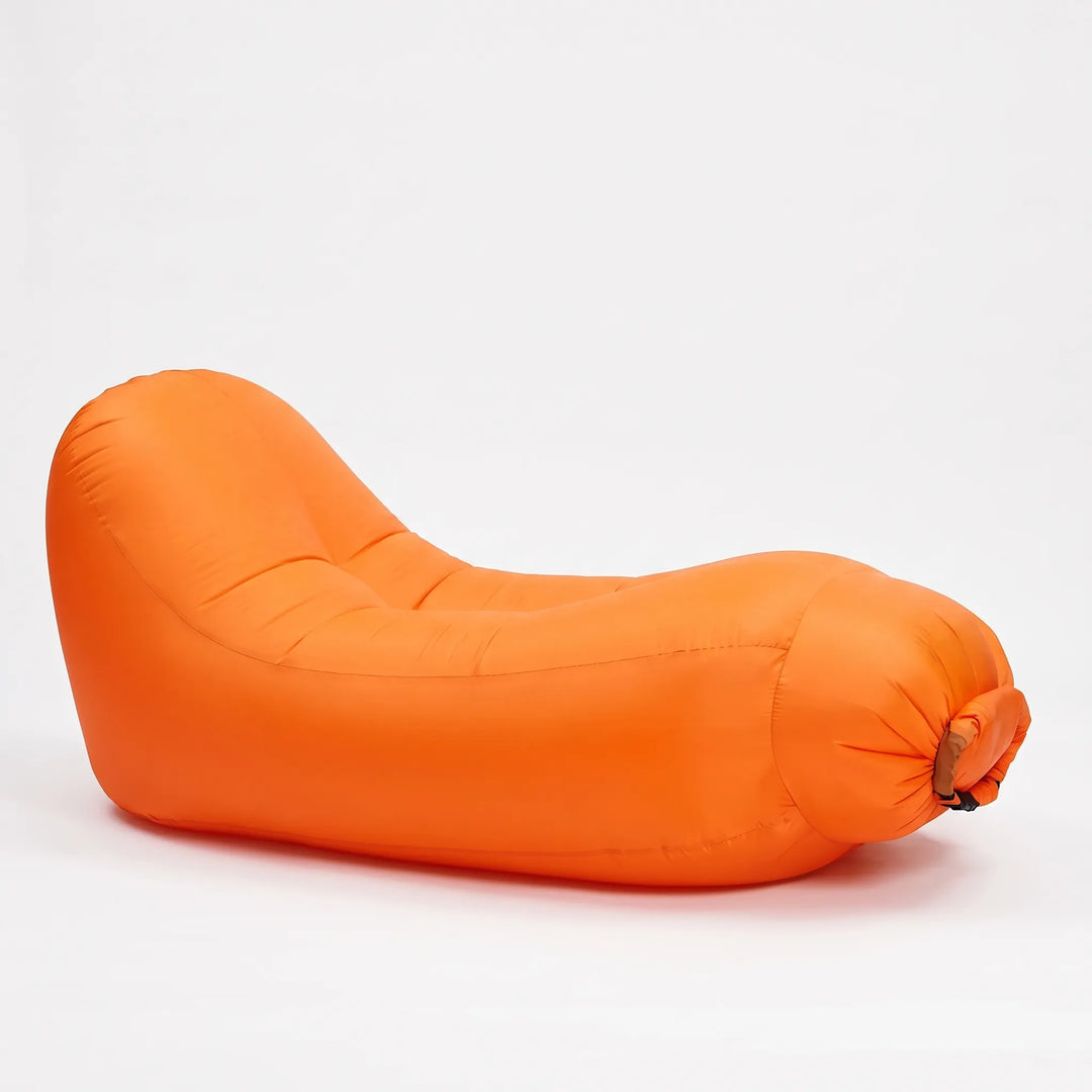 Durable inflatable outdoor chair, a compact and portable lounge solution for unisex outdoor seating.
