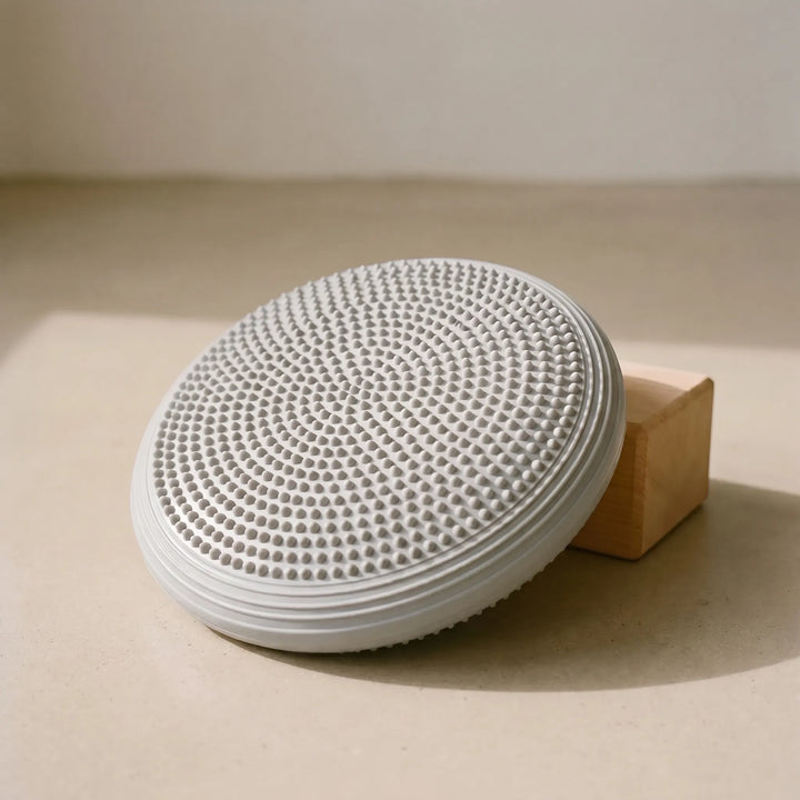 Unisex inflatable round balance cushion for core training and improved stability.
