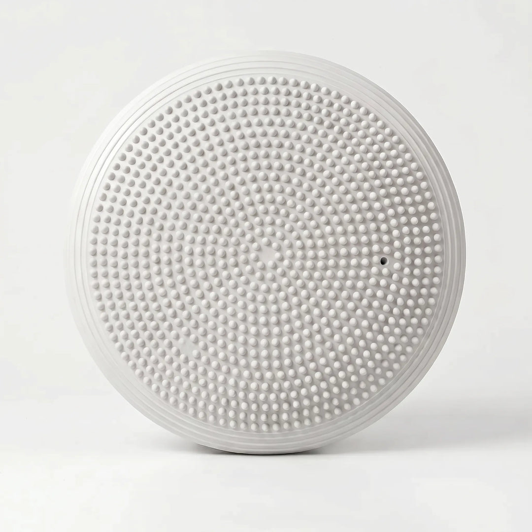 Unisex stability disc, an inflatable balance cushion ideal for fitness, yoga, and active sitting.
